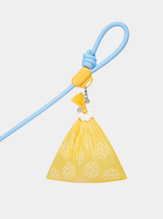 AURA Hands-Free Poop Bag Clip — PETAL — styled in a home setting