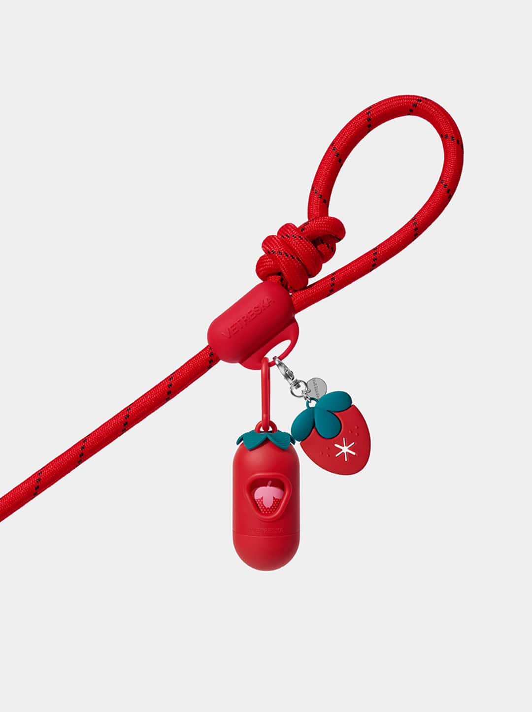 AURA Hands-Free Poop Bag Clip — BERRY — in use