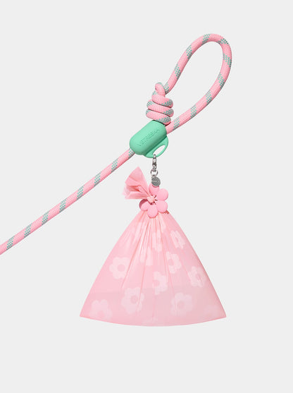 AURA Hands-Free Poop Bag Clip — MEADOW — styled in a home setting