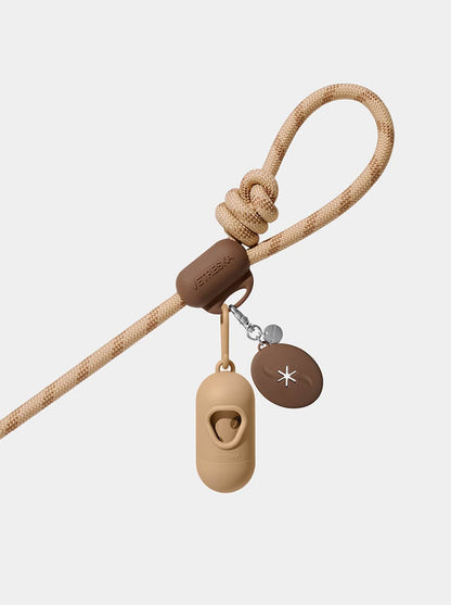 AURA Hands-Free Poop Bag Clip — MOCHA — in use