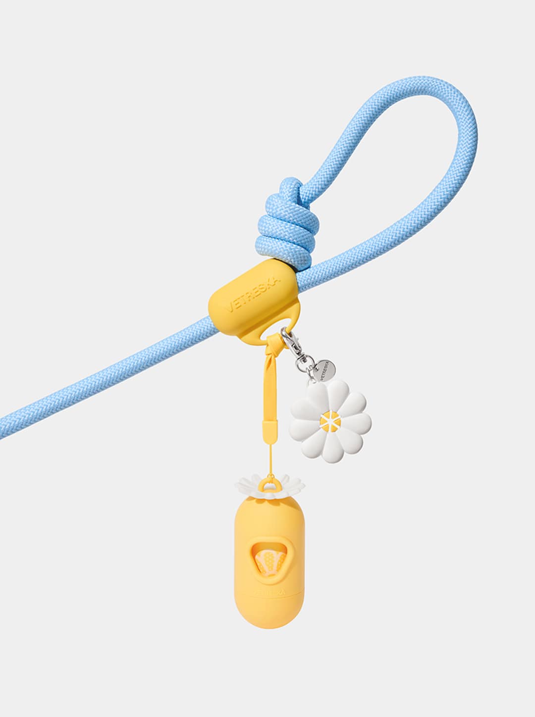 AURA Hands-Free Poop Bag Clip — PETAL — in use